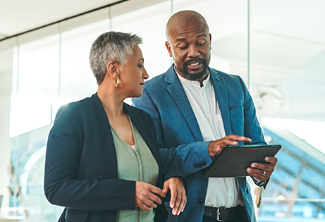 Media Relations - Man and woman looking at figures